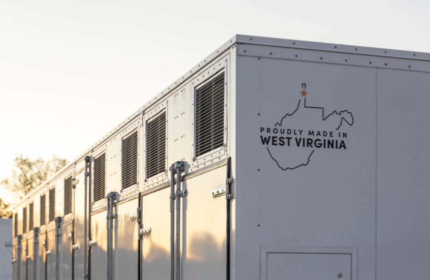 A grid-scale battery stands against a clear sky.